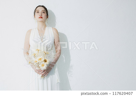 young woman in white dress 117620407