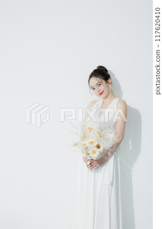 young woman in white dress 117620410