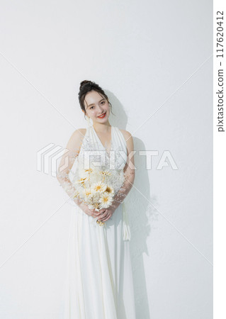 young woman in white dress 117620412