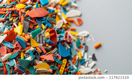 Colorful Microplastics on White Background Highlighting Environmental Hazard Colorful Microplastics on White Background Highlighting Environmental Hazard 117621320