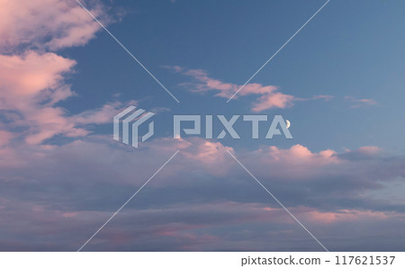 Pink and blue sunset. Romantic dramatic background for design. Moon in sky and clouds. Pink and blue sunset. Romantic dramatic background for design. Moon in sky and clouds. 117621537