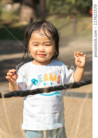 Infants playing in the park 117621579