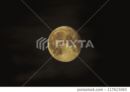 A round moon floating in the night sky A round moon floating in the night sky 117623065