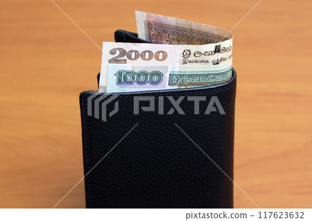 Sri Lankan rupee in the black wallet 117623632