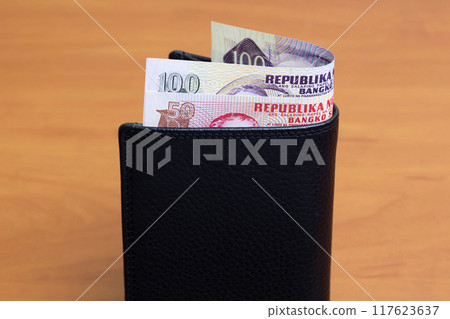 Philippine peso in the black wallet 117623637