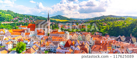Panoramic view of Cesky Krumlov with St Vitus church in the middle of historical city centre. Cesky Krumlov, Southern Bohemia, Czech Republic. Panoramic view of Cesky Krumlov with St Vitus church in the middle of historical city centre. Cesky Krumlov, Southern Bohemia, Czech Republic. 117625089