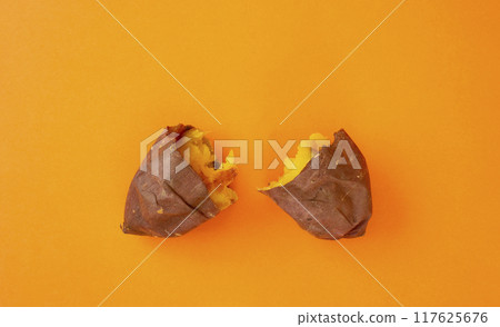 Baked sweet potato (sweet potato) over orange background 117625676