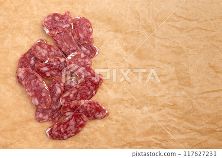 slices of salami on parchment paper slices of salami on parchment paper 117627231