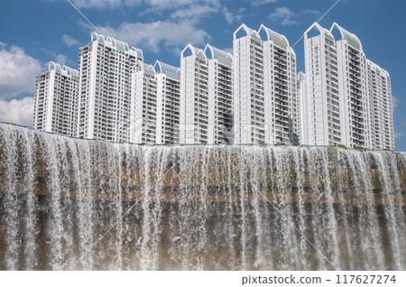 Beautiful view of Kunming waterfall park in China. The waterfall is claimed to be the largest man-made one in Asia which is 12.5 meters in height and 400 meters in width. 117627274