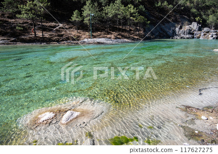 Freshwater flowing through the Blue Moon Valley a popular spot inside the Jade Dragon Snow Mountain Scenic Area of Lijiang, in Yunnan province, China. 117627275
