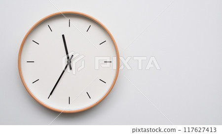 Minimalist wooden Wall Clock on White Wooden Surface with Space for Text. Time Set at 23.35/11.35 Minimalist wooden Wall Clock on White Wooden Surface with Space for Text. Time Set at 23.35/11.35 117627413