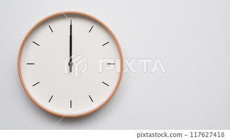 Minimalist wooden Wall Clock on White Wooden Surface with Space for Text. Time Set at 12.00/00.00/24.00 Minimalist wooden Wall Clock on White Wooden Surface with Space for Text. Time Set at 12.00/00.00/24.00 117627418