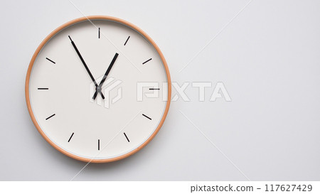 Minimalist wooden Wall Clock on White Wooden Surface with Space for Text. Time Set at 00.55/12.55 Minimalist wooden Wall Clock on White Wooden Surface with Space for Text. Time Set at 00.55/12.55 117627429