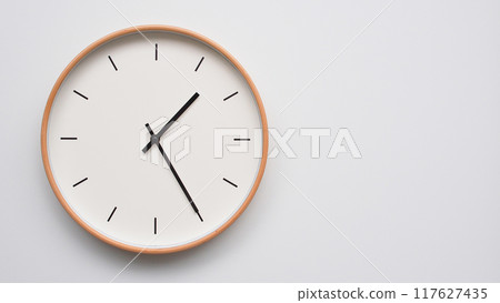 Minimalist wooden Wall Clock on White Wooden Surface with Space for Text. Time Set at 13.25/01.25 Minimalist wooden Wall Clock on White Wooden Surface with Space for Text. Time Set at 13.25/01.25 117627435
