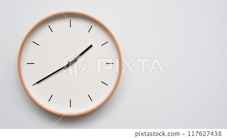 Minimalist wooden Wall Clock on White Wooden Surface with Space for Text. Time Set at 13.40/01.40 Minimalist wooden Wall Clock on White Wooden Surface with Space for Text. Time Set at 13.40/01.40 117627438