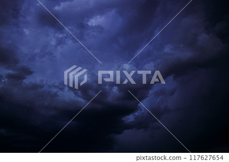 Cloudy Sky With Blue Dark Storm Clouds During Rain. Natural Background With Rainclouds. natural weather background dark blue backdrop thunderstorm stormy sky. abstract-background-design, abstract 117627654