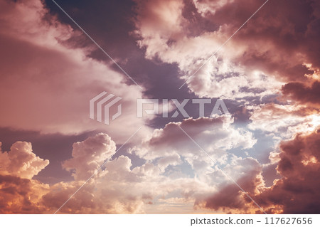 Toned Pink-yellow Clouds. Toned Cumulus Clouds Float In Blue Sky. Saturated Yellow Colors Of Clouds. . Unusual Sky Background. Rich Colors Pink Colors. Sky Sunset Sunrise Background. Cloudy Sky. Sunny 117627656