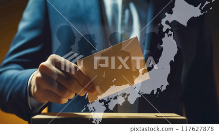 Voting scene with focus on hand holding ballot 117627878