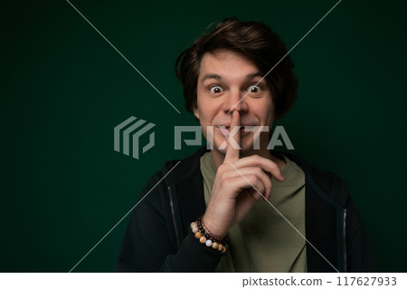 Man Making Funny Face With Finger 117627933