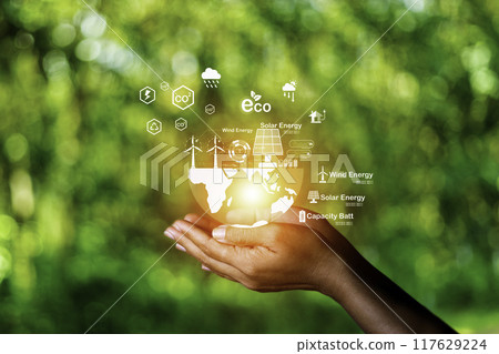 net zero concept. Hand holding with net zero icon on blur green leaf. carbon neutral and green natural background on with clean energy icon around it. Carbon gas affects global warming.. net zero concept. Hand holding with net zero icon on blur green leaf. carbon neutral and green natural background on with clean energy icon around it. Carbon gas affects global warming.. 117629224