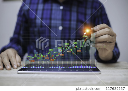 Display stock market charts. Business hand working with stock market investment use tablet. Investment growth The growing power of the compound interest concept. success wealth stock investment. 117629237