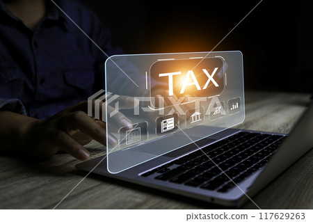 Businessman using laptop to fill in the income tax online return form for payment.business using computer filling personal income tax return to pay tax.Futuristic virtual screen interface technology. 117629263