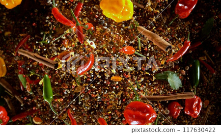 Freeze Motion Shot of Flying Mix Spices . Isolated on Black Background 117630422