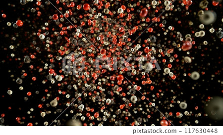 Freeze Motion of Flying Dry Whole Pepper Spice Isolated on Black Background 117630448