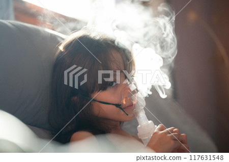 Sick girl kid with inhaler mask Sick girl kid with inhaler mask 117631548