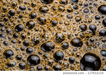 Air bubbles on the surface of hot black coffee. Air bubbles on the surface of hot black coffee. 117632210