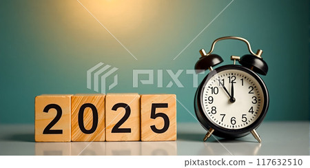 New Year Eve 2025 concept featuring midnight alarm clock and Happy New Year message above wooden block digits on light blue backdrop, holiday cards and seasonal promotional materials New Year Eve 2025 concept featuring midnight alarm clock and Happy New Year message above wooden block digits on light blue backdrop, holiday cards and seasonal promotional materials 117632510