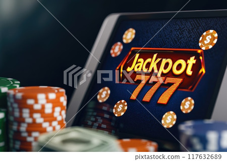 A tablet showing displaying Jackpot 777 surrounded by virtual money, Online betting banner A tablet showing displaying Jackpot 777 surrounded by virtual money, Online betting banner 117632689