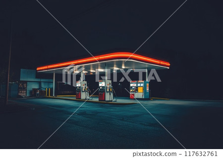 A gas station with three pumps and a red roof with neon light A gas station with three pumps and a red roof with neon light 117632761
