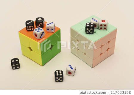 Rubik's cube and dice on a white background. Rubik's cube and dice on a white background. 117633198