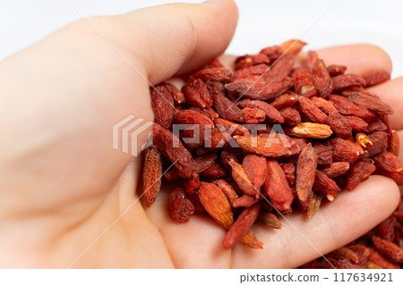Handful of dried goji berries close-up 117634921