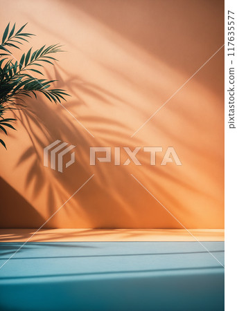 background with blurred palm foliage shadow on Peach color wall 117635577