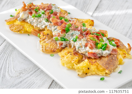 Crispy smashed potatoes Crispy smashed potatoes 117635751