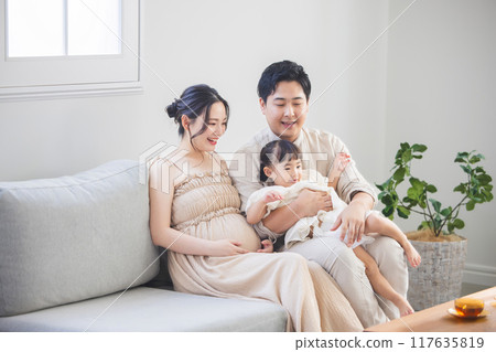 A family spending in the living room A family spending in the living room 117635819