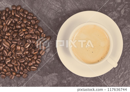 Roasted fragrant coffee grains and coffee with milk. Vintage photo 117636744