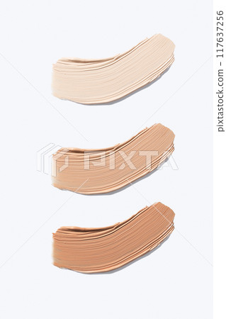 Set liquid foundation smudge on white background. Beauty skincare texture swipe swatch. Cosmetic makeup cream sample isolated on white 117637256
