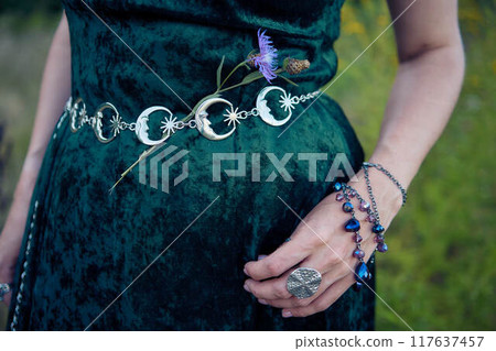 woman in whimsical aesthetic style dress in field in summer at sunset woman in whimsical aesthetic style dress in field in summer at sunset 117637457