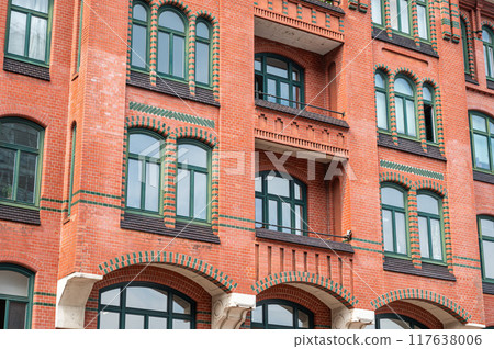 Hamburg, Germany, July 19, 2024 - Traditional decorated brick stone facade of apartment block 117638006
