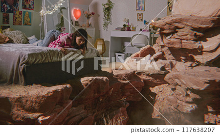Teenager girl looks at virtual reality AI hologram of rocks Teenager girl looks at virtual reality AI hologram of rocks 117638207