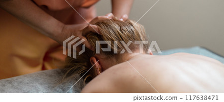 Head massage. Masseuse, client and scalp care, headache treatment and physiotherapy for healing 117638471