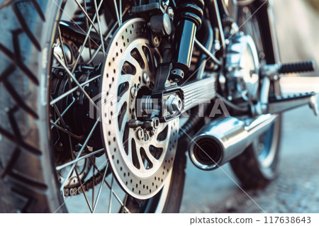 Close Up of Motorcycle Tire and Disc Brakes 117638643