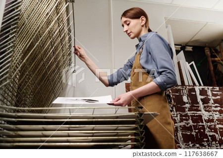Putting paper with sketch on top tier Putting paper with sketch on top tier 117638667