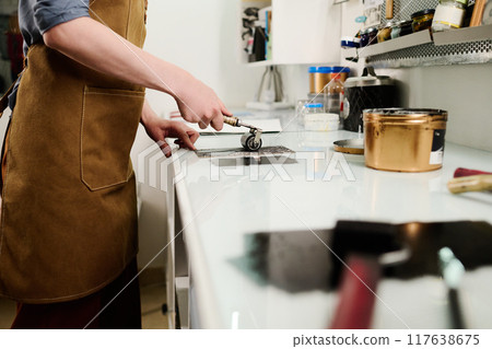 Young female designer working in studio Young female designer working in studio 117638675