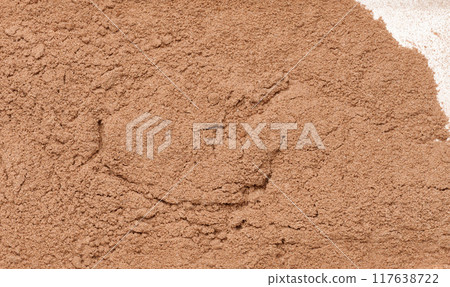Dry ground cocoa powder, texture. 117638722