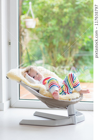 Toddler child in rocking chair 117638797