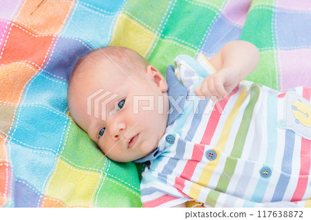 Little baby on colorful blanket 117638872